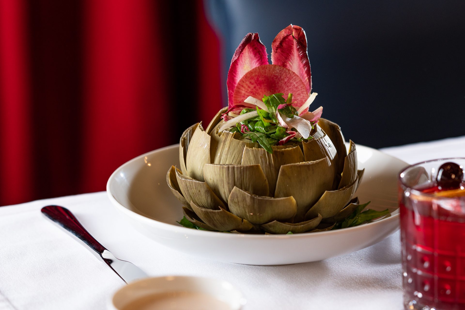 Plate of Artichoke Vinaigrette with Raoul's dressing served at Fine Dining Restaurant Riyadh - Cool Inc