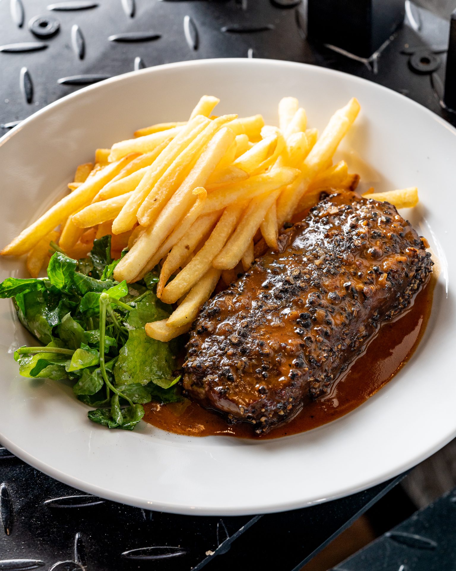 Pepper steak with French Fries served at Raoul's, a fine dining restaurant in Riyadh - Cool In