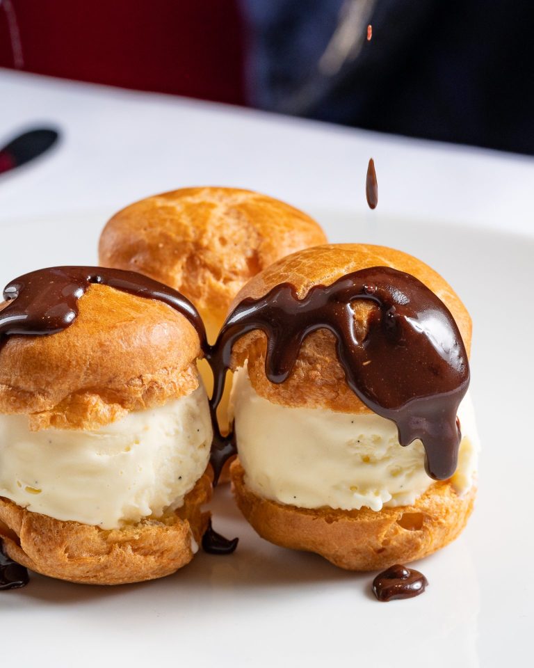 Mouthwatering Profiteroles dessert at Raoul's, a French restaurant in Riyadh - Cool Inc