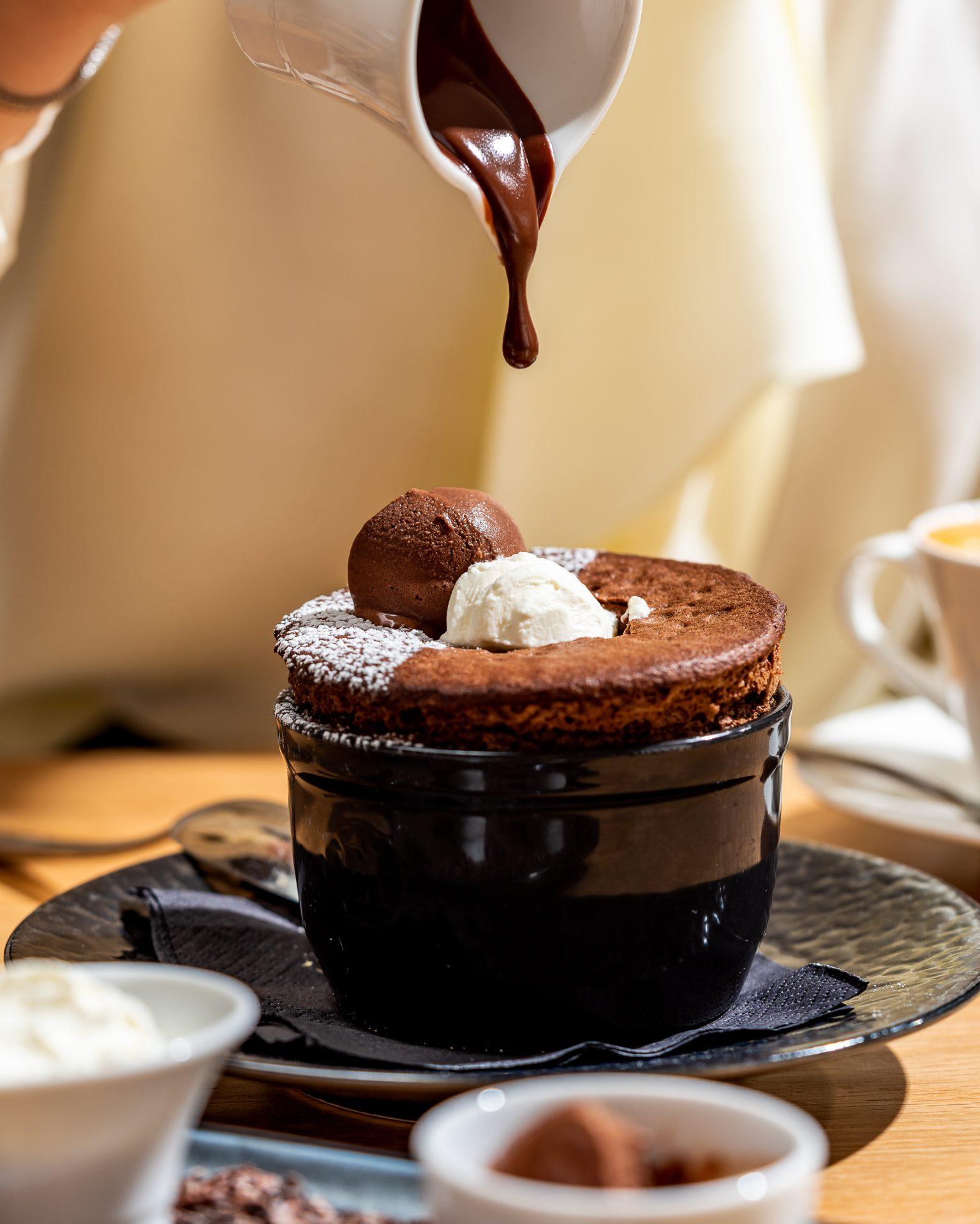 A luscious chocolate souffle dessert served at Spago, a fine dining restaurant in Riyadh - Cool Inc