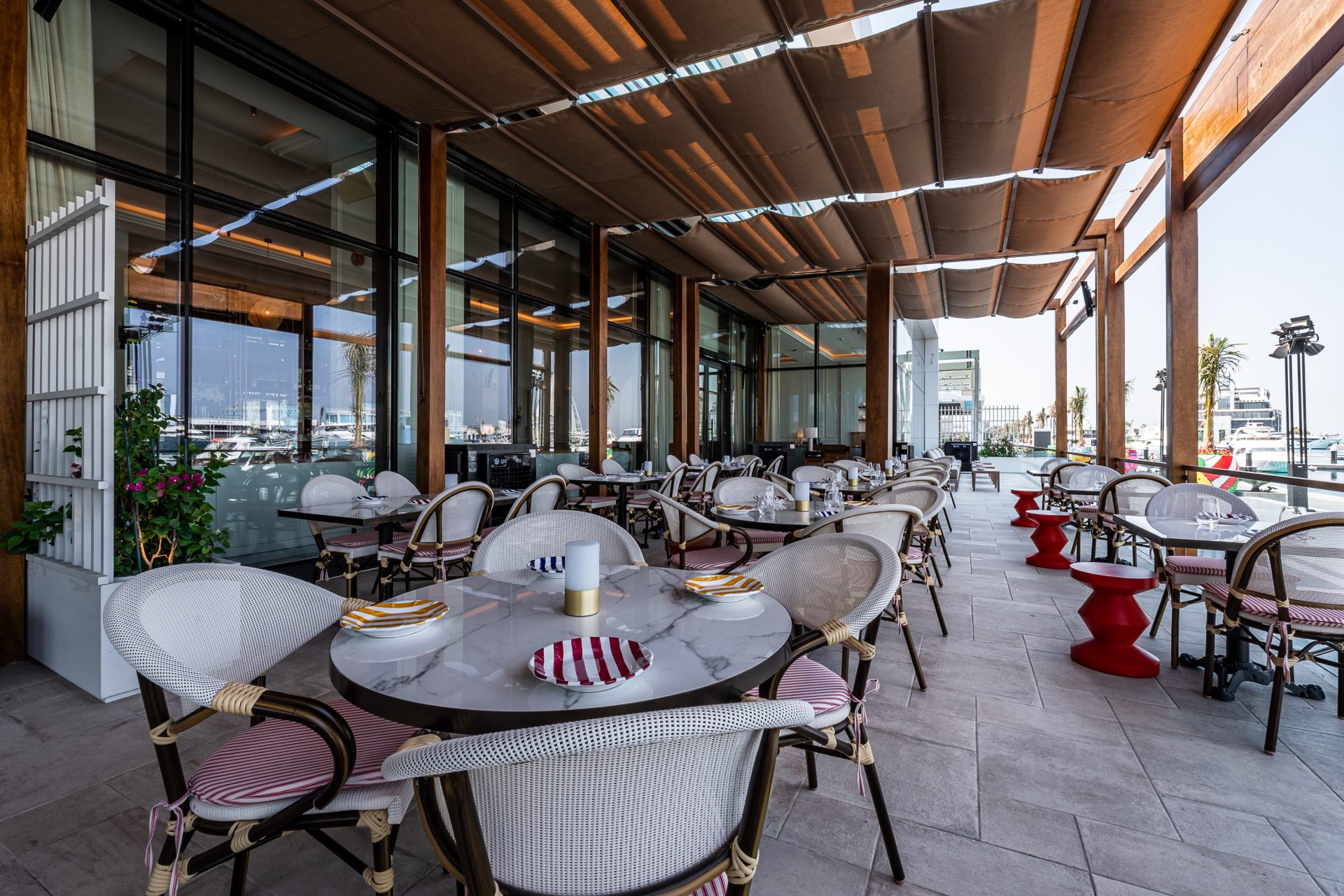 Fancy Dining area on the terrace of Le Comptoir De Nicole - French Cuisine Restaurant at Jeddah Yacht Club