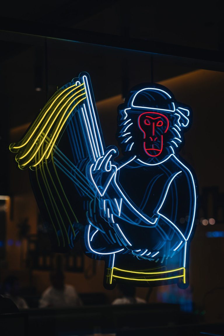 Vibrant monkey neon light sign illuminating Mashi no Mashi Japanese Restaurant - Jeddah Yacht Club - Cool Inc
