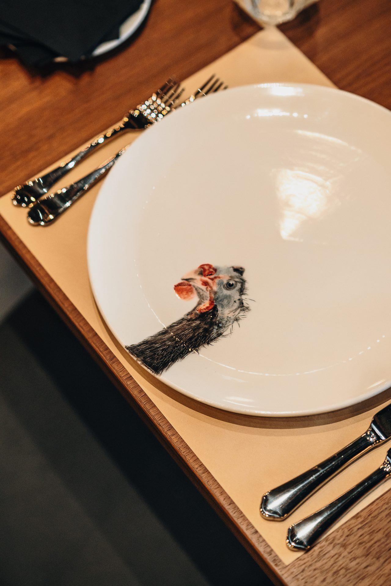 Rooster Dining Plate and Spoons on Table at CHI SPACCA Restaurant, a Fancy Dining Restaurant in Riyadh - Cool Inc